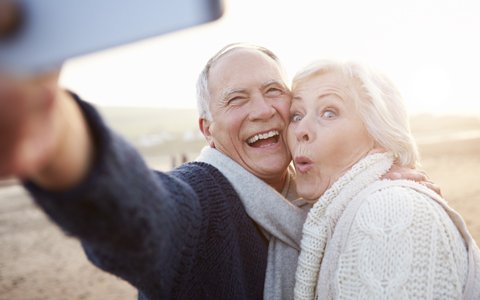 older couple taking a selfie