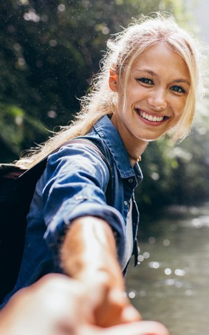 blonde woman with a beautiful smile she got with cosmetic dentistry near Centerport