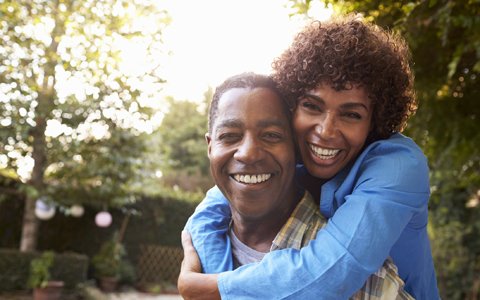 happy couple who had gum recession surgery in Huntington NY