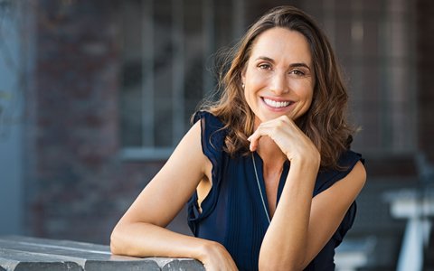 smiling woman wearing clear braces