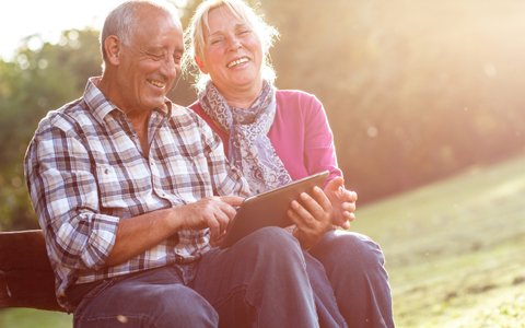 older laughing couple who have dentures