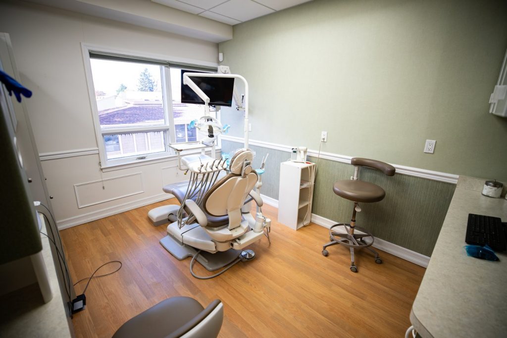 Dentist's chair with dental instruments looking out window in Huntington, NY