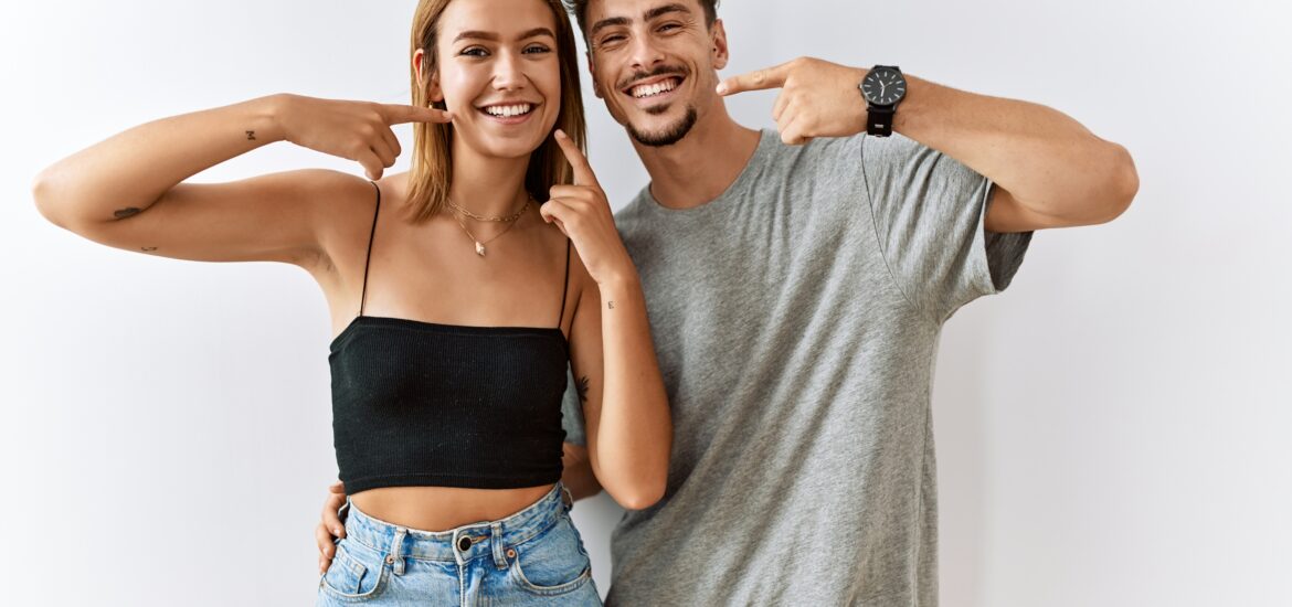 two young adults smiling confidently