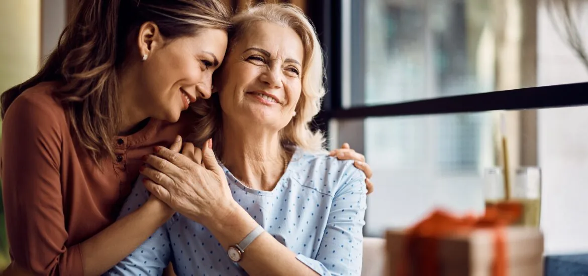 Happy senior woman enjoying in daughter's affection