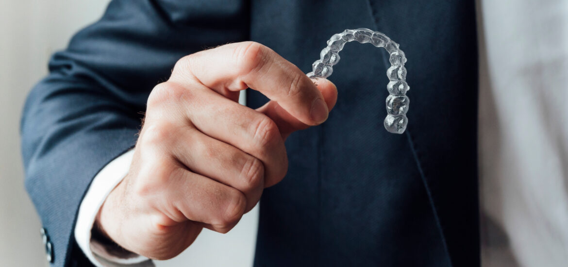 Professional showing dental clear aligners