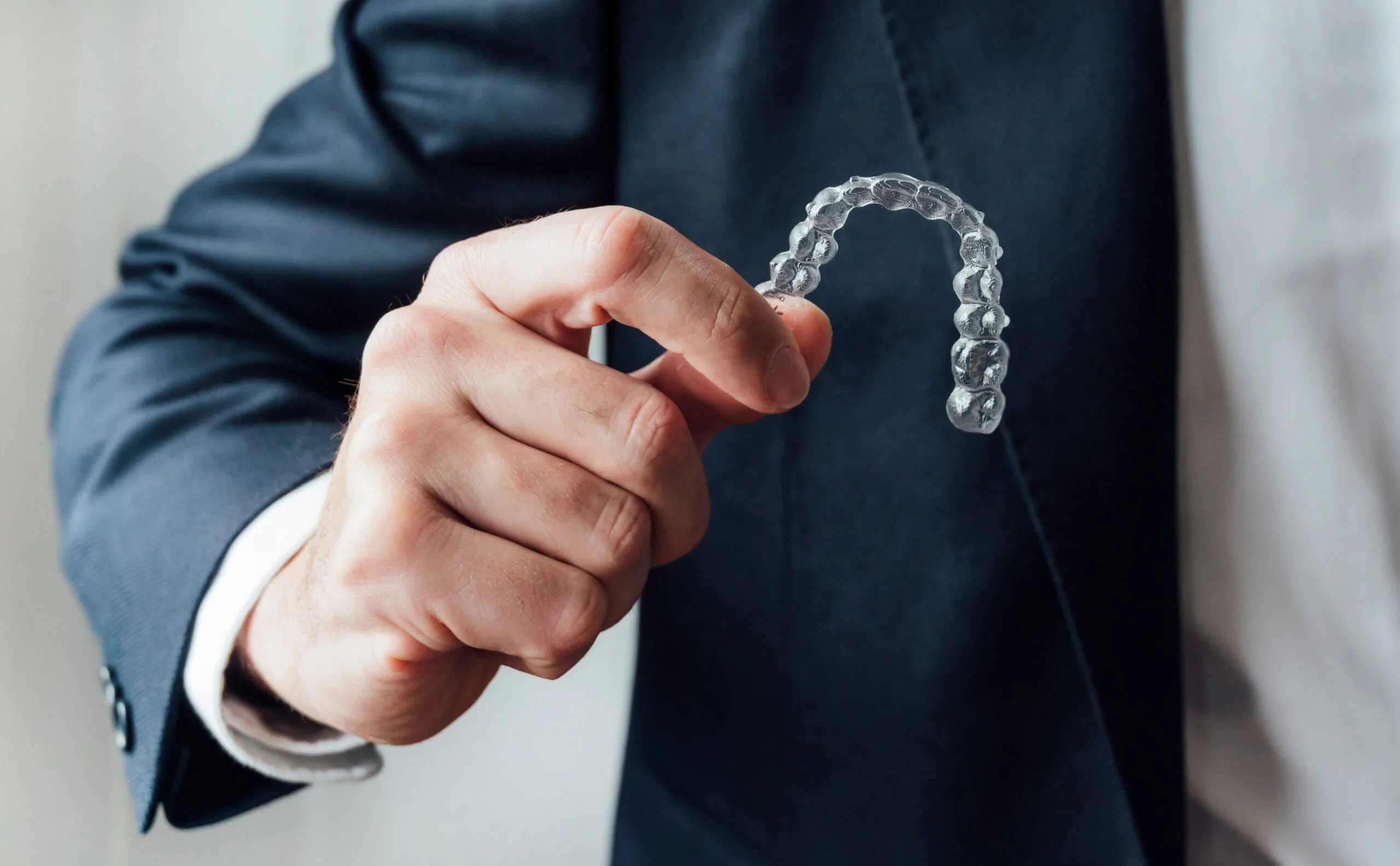 Professional showing dental clear aligners