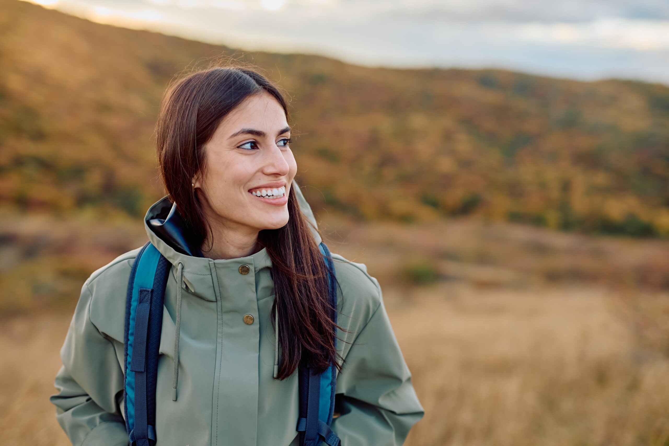 happy woman smiling outdoors, perfect white teeth