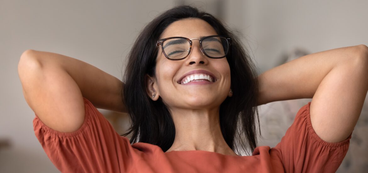 happy young woman showing her perfect white smile