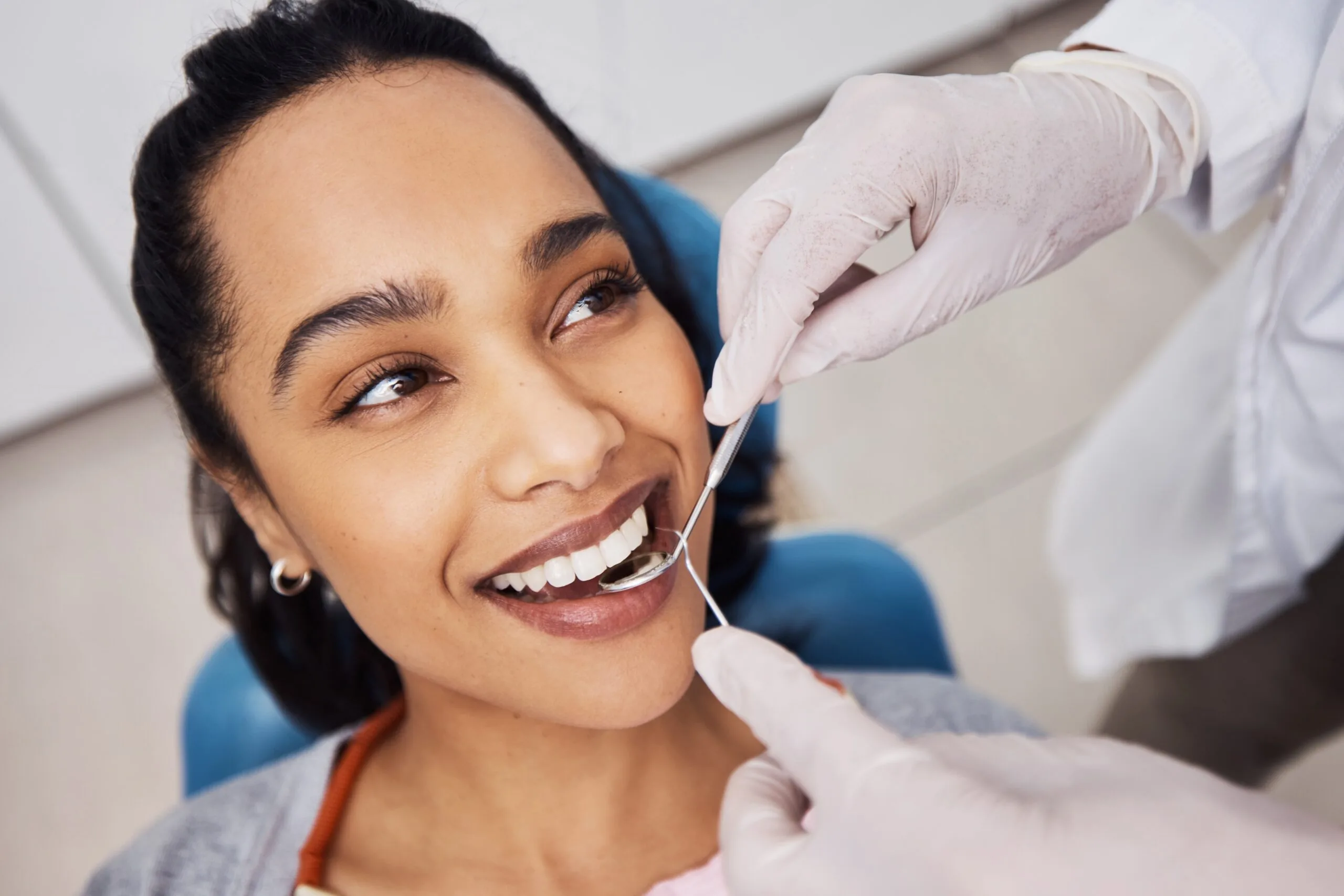 dentist working no a woman, new dental veneers